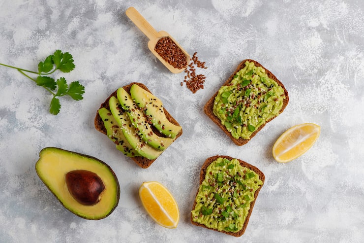 Avocado on toast providing potassium and healthy fats for a flat stomach.