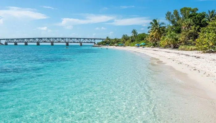 Crystal-clear turquoise ocean waters and white sandy beach at Bahia Honda State Park in the Florida Keys.